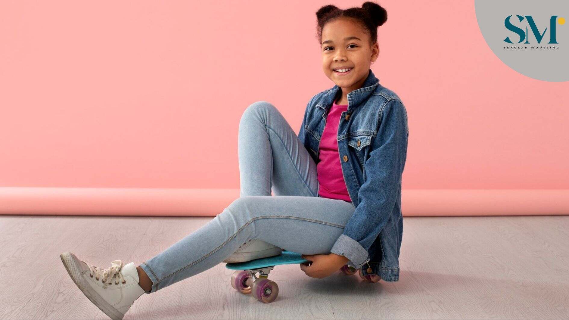 Portrait of young girl with skateboard