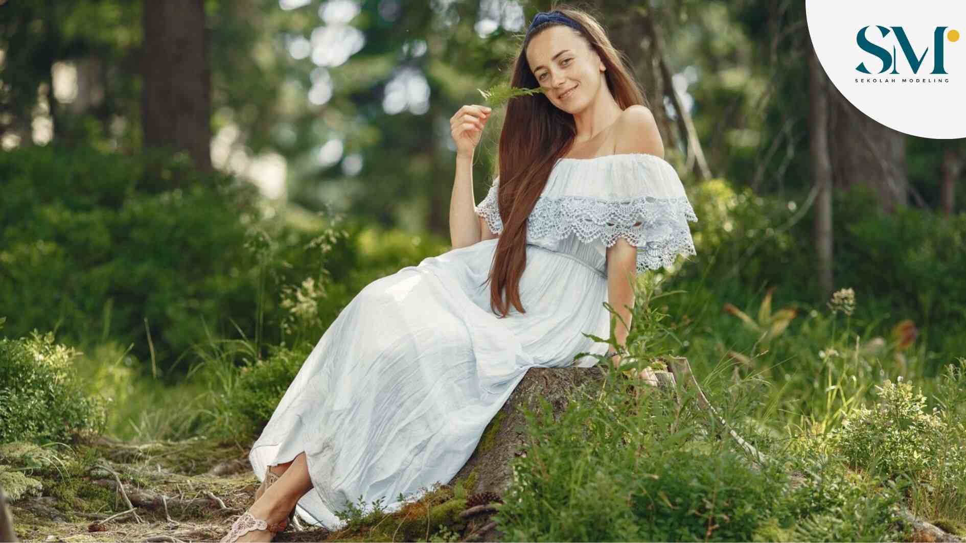 Woman with long hair. Lady in a blue dress. Girl with untouched nature