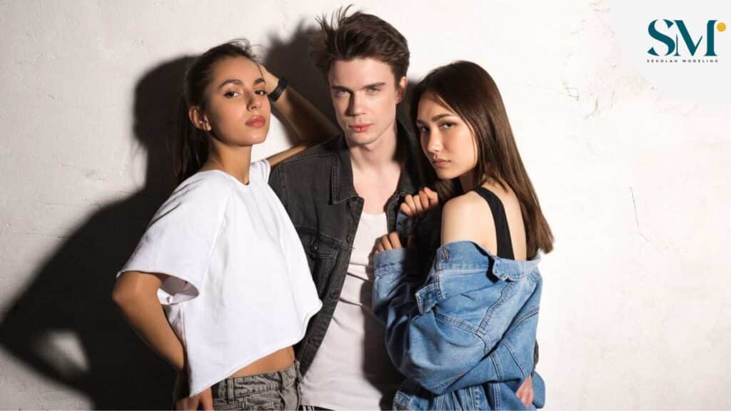 Concentrated young man standing with friends