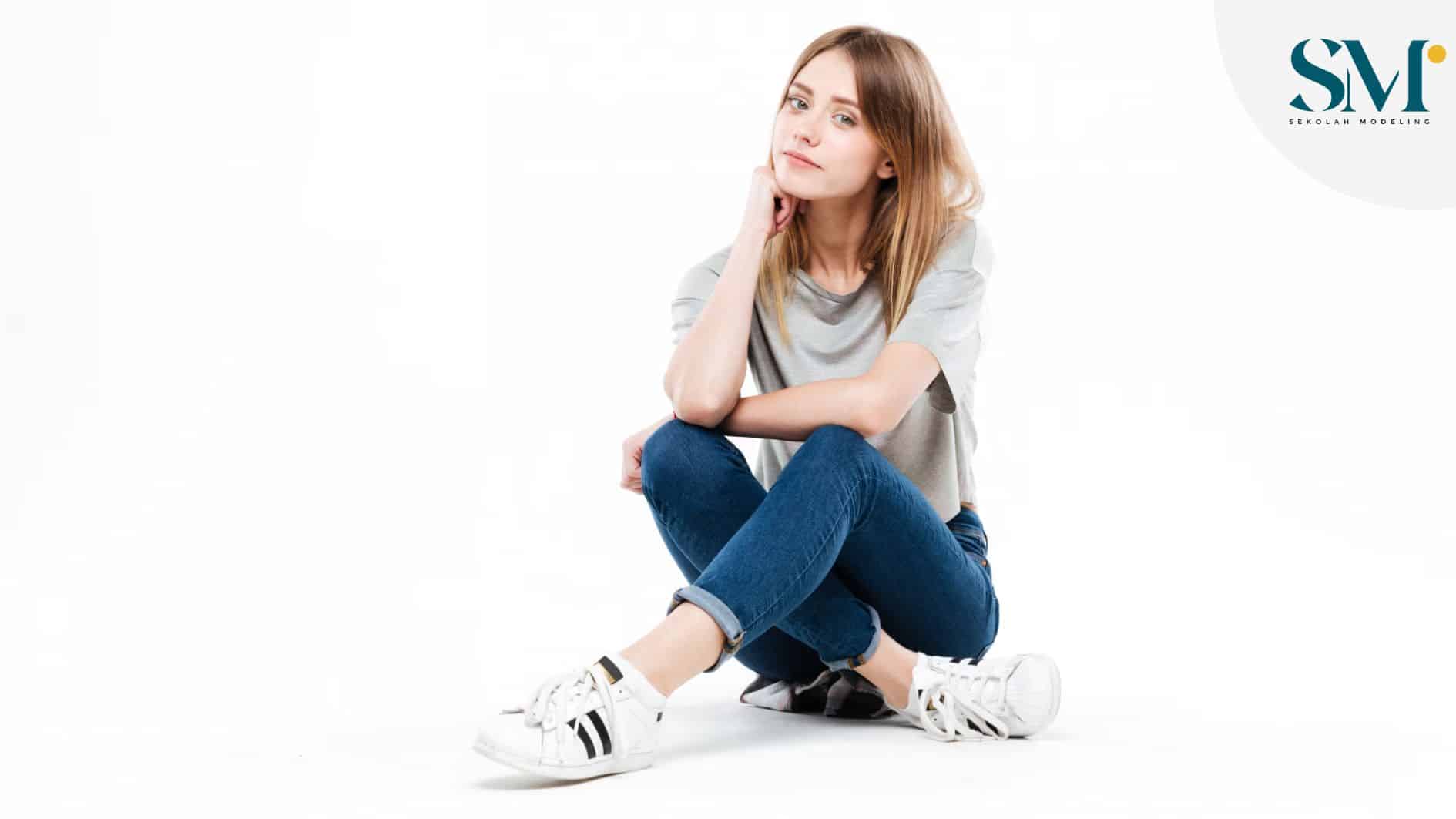 thoughtful woman sitting cross legged