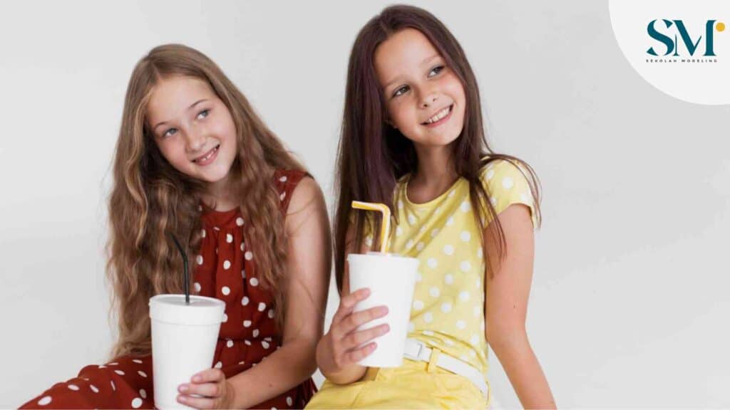 Medium shot girls holding cups