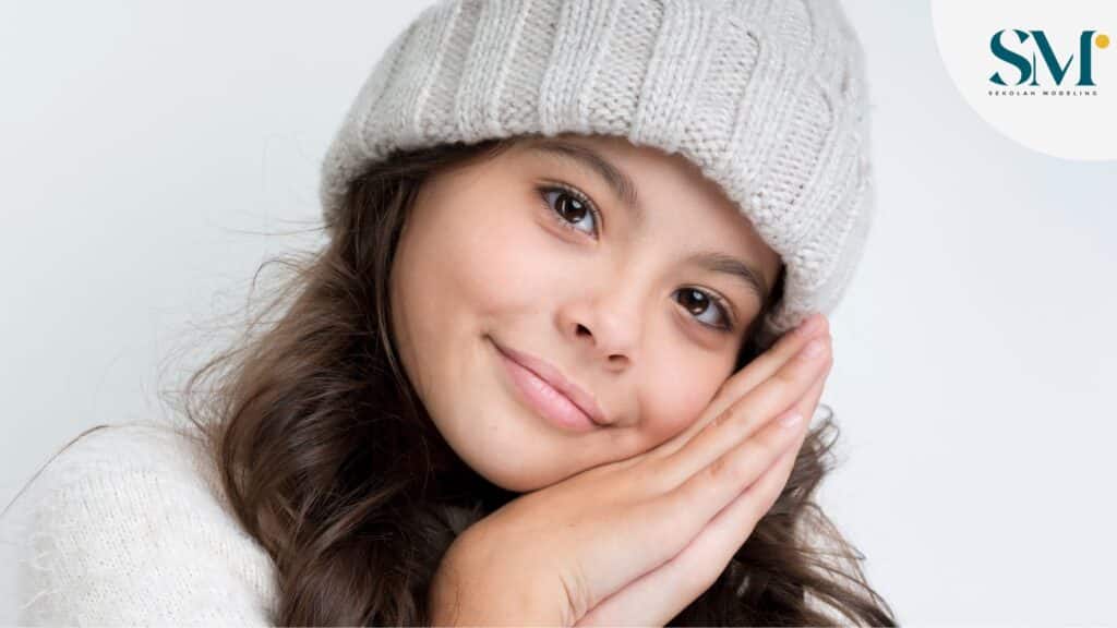 Close-up young girl wearing winter clothes